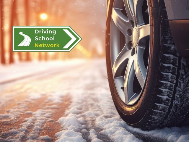 close up of car wheel on snowy road
